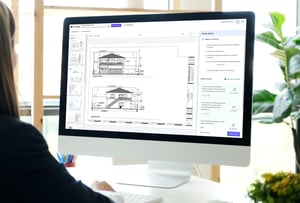 Image of a plan reviewer working on their computer using CivCheck's AI 